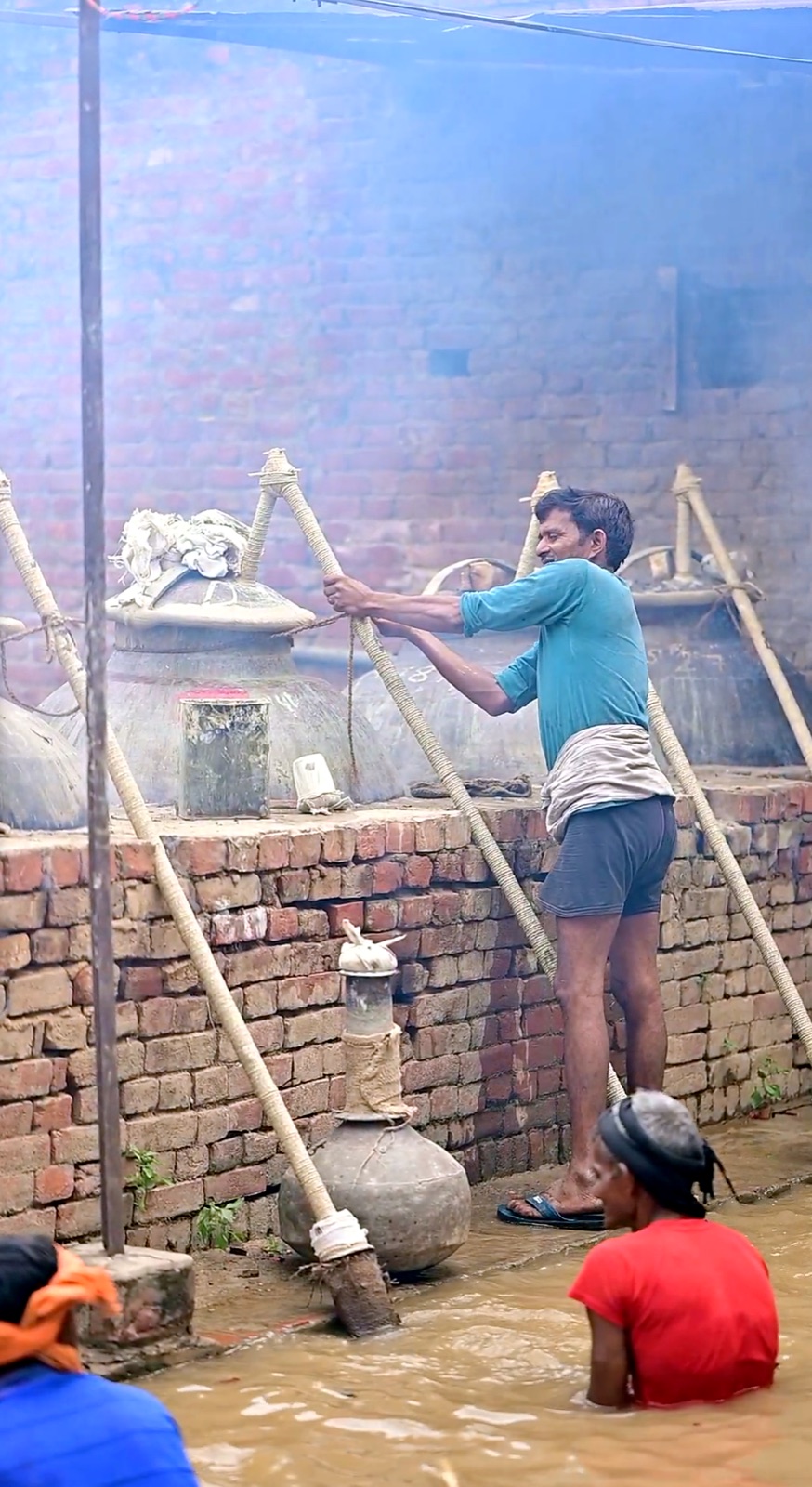 Bamboo pipe connecting vessels in a traditional Kannauj deg bhapka setup